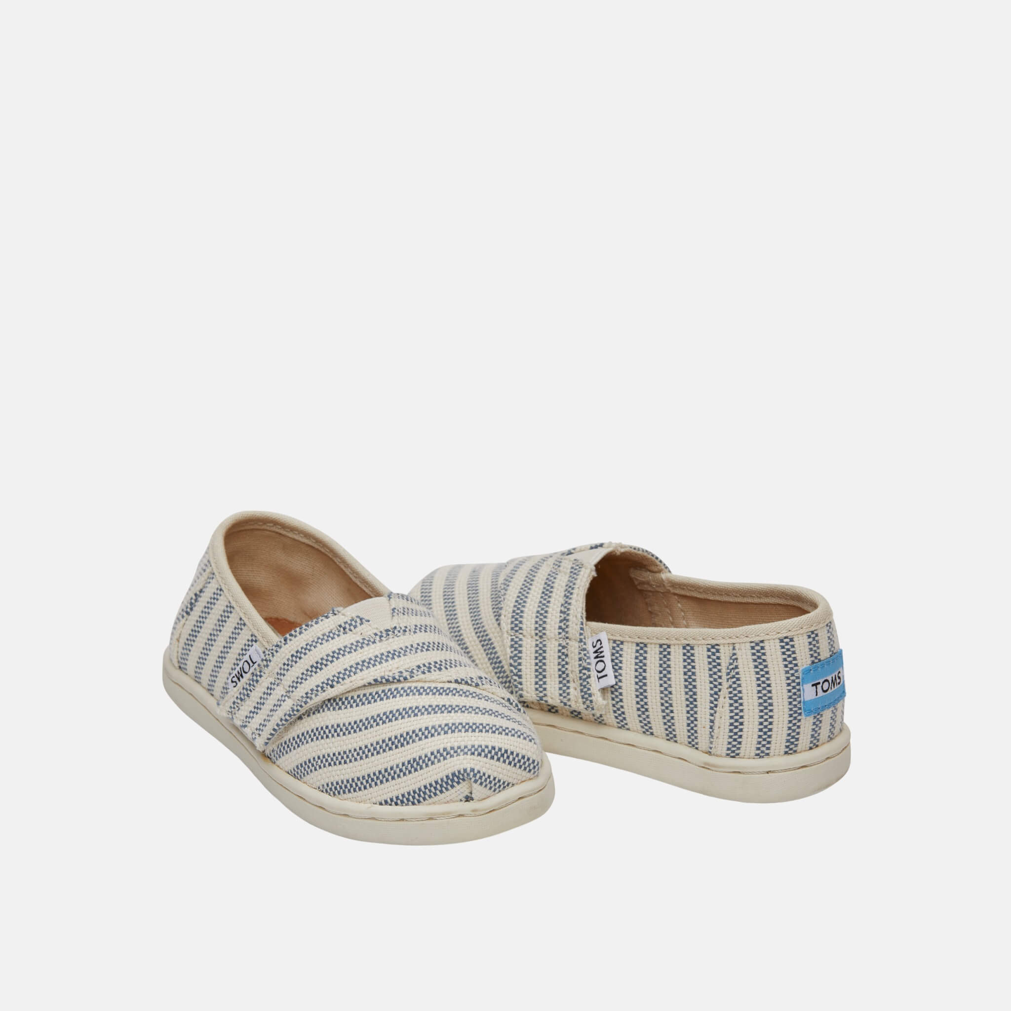 Dětské krémovo-modré TOMS Stripes Seasonal Classics Tiny Alpargata