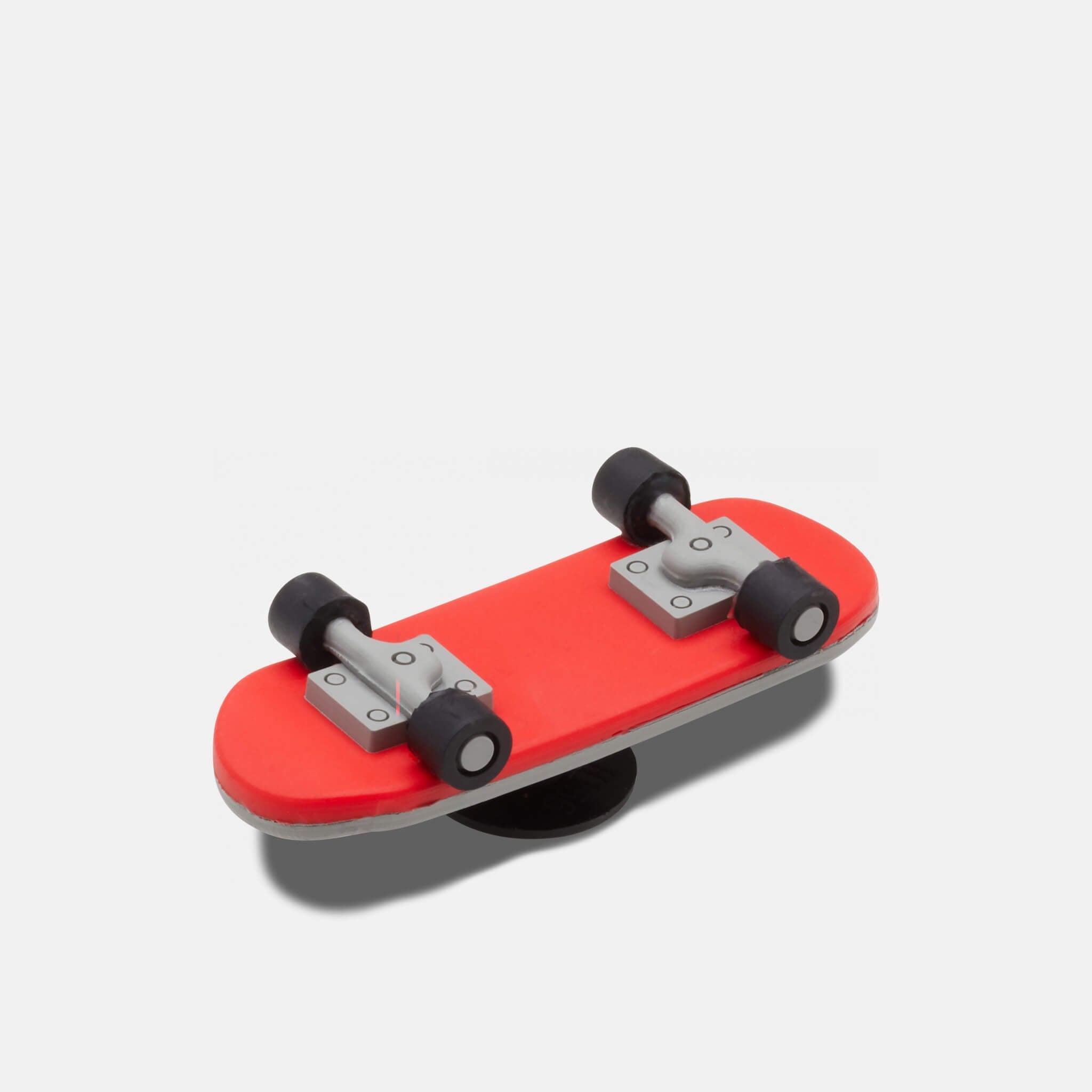 Odznáček Jibbitz - 3D Skateboard